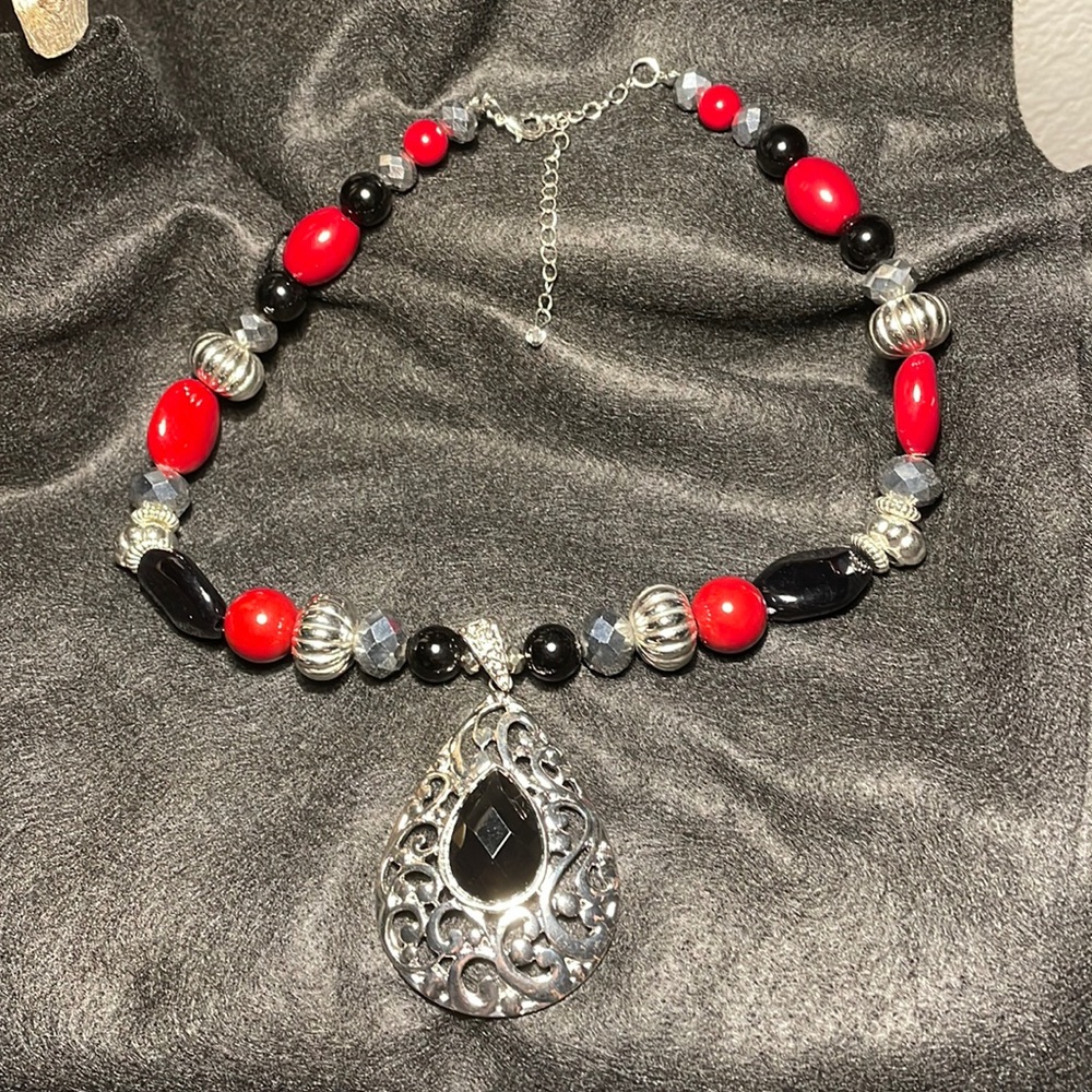 Silver necklace with black and red stones